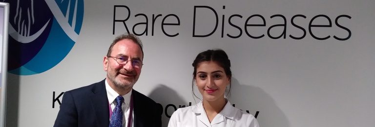 Centre for Rare Diseases personnel in front of logo