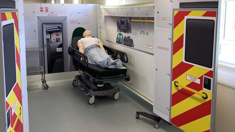 simulated patient on simulated ambulance