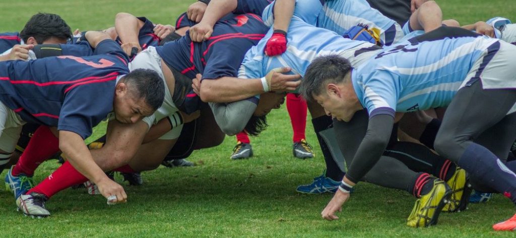 rugby players form a scrum